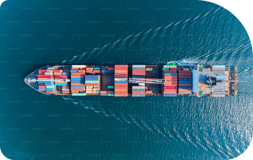 Aerial view of a container ship on deep blue ocean waters